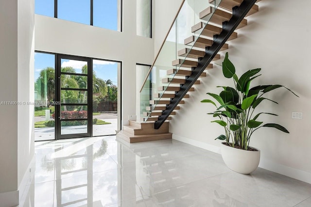 foyer entrance featuring a high ceiling