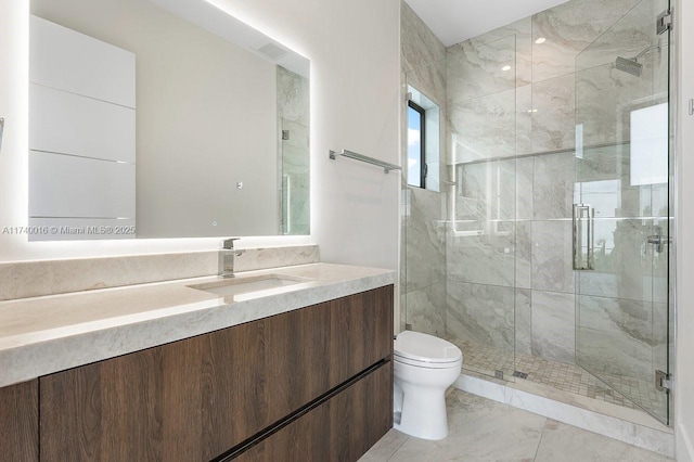 bathroom featuring vanity, toilet, and walk in shower