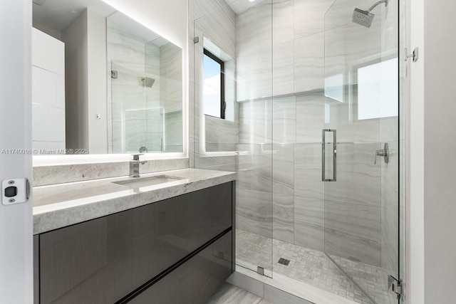 bathroom with vanity and walk in shower