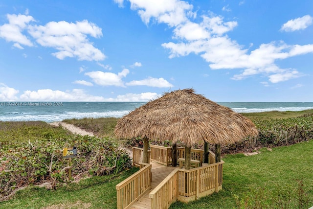 view of water feature featuring a view of the beach and a gazebo