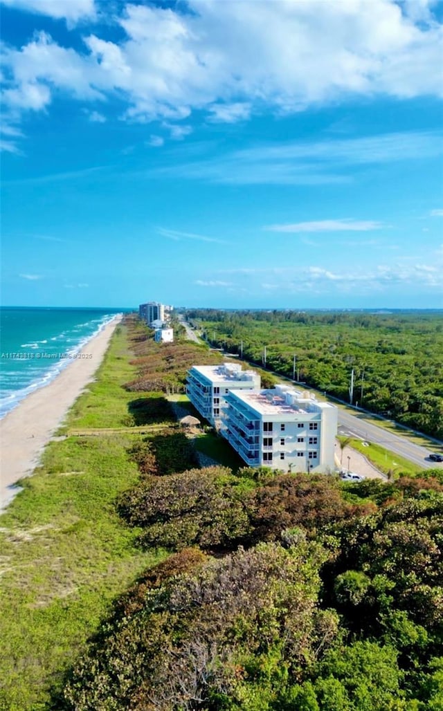 aerial view featuring a water view and a beach view