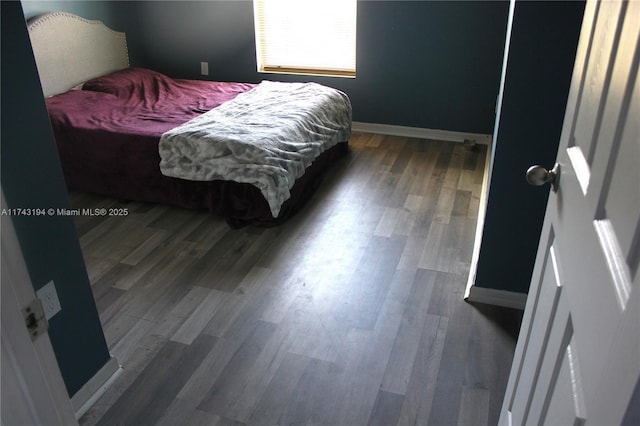 bedroom featuring dark hardwood / wood-style flooring