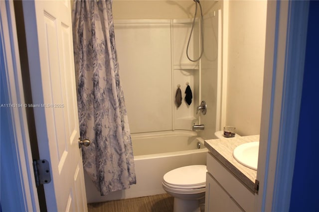 full bathroom featuring shower / bath combo with shower curtain, vanity, and toilet