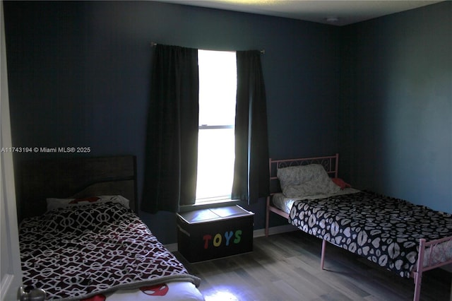 bedroom with wood-type flooring