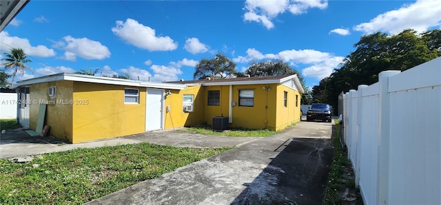 view of front of property featuring central air condition unit