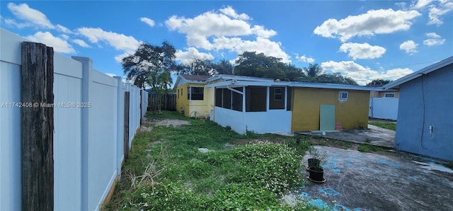 view of side of home with a patio