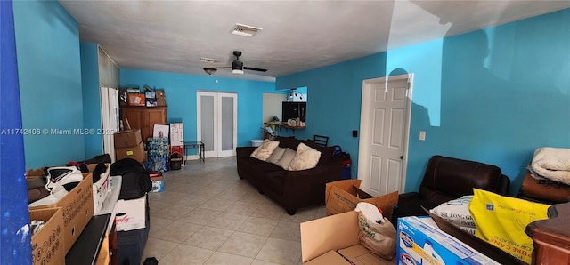 tiled living room featuring ceiling fan