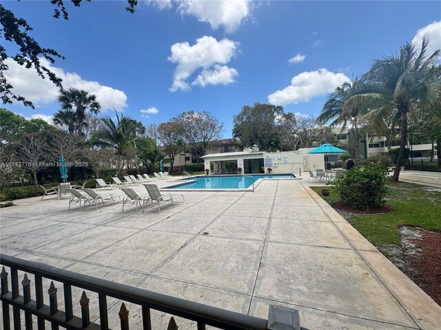 5155 E Sabal Palm Blvd Unit 204, Tamarac, FL 33319 - pool featuring a patio area