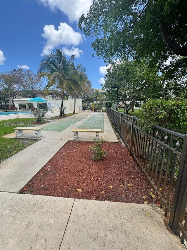 5155 E Sabal Palm Blvd Unit 204, Tamarac, FL 33319 - view of property's community with a pool, shuffleboard, and fence