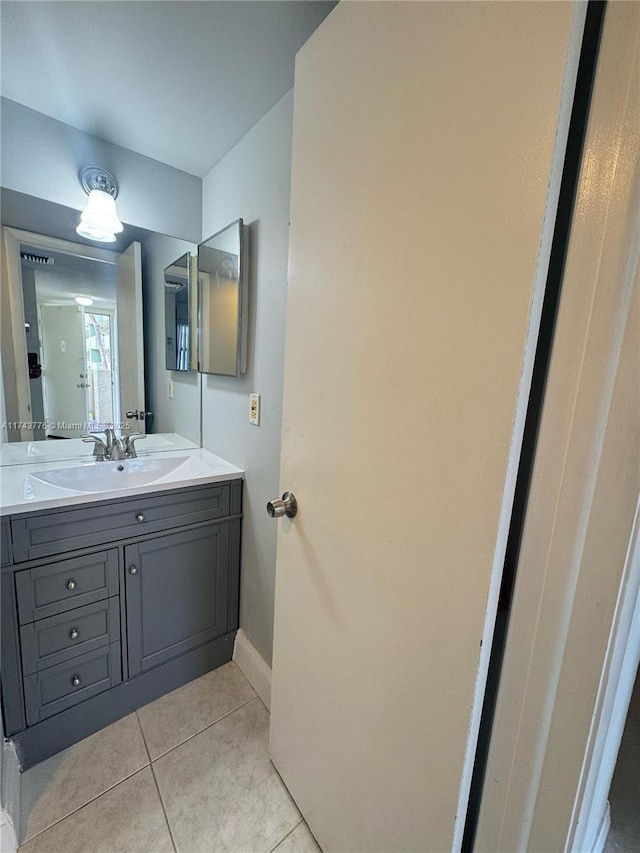5155 E Sabal Palm Blvd Unit 204, Tamarac, FL 33319 - bathroom with tile patterned floors, baseboards, and vanity