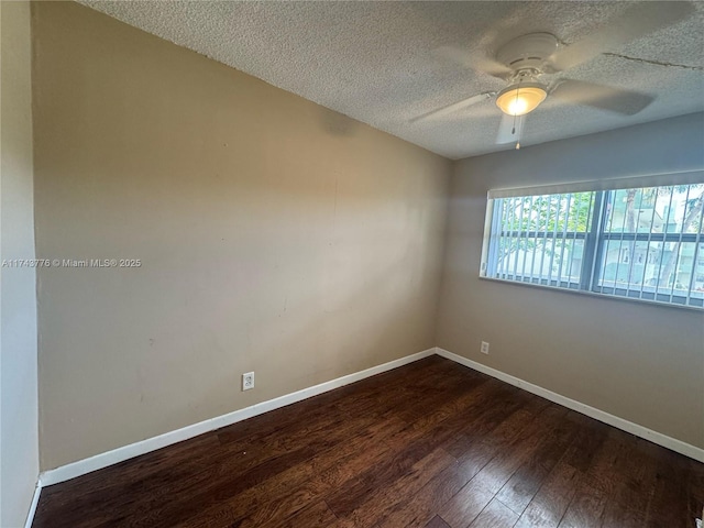 5155 E Sabal Palm Blvd Unit 204, Tamarac, FL 33319 - unfurnished room with dark wood finished floors, baseboards, a ceiling fan, and a textured ceiling