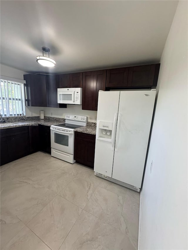 5155 E Sabal Palm Blvd Unit 204, Tamarac, FL 33319 - kitchen with marble finish floor, dark brown cabinetry, light stone countertops, and white appliances