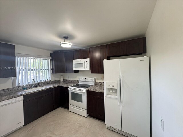 5155 E Sabal Palm Blvd Unit 204, Tamarac, FL 33319 - kitchen featuring dark brown cabinets, a sink, white appliances, and stone counters