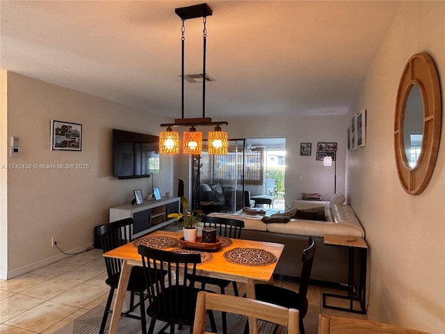 dining room featuring light tile patterned flooring