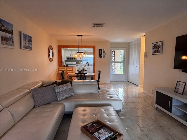 living room with light tile patterned flooring