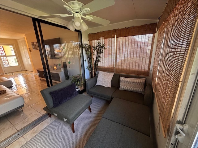 sunroom featuring vaulted ceiling and ceiling fan