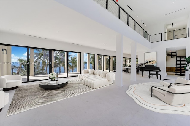 living room featuring a high ceiling