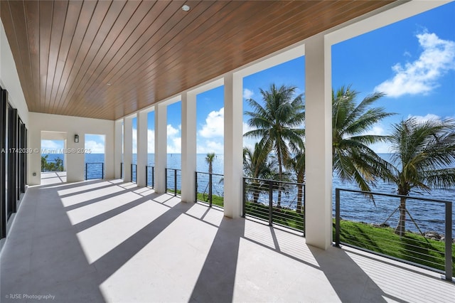 650 Lugo Ave, Coral Gables, FL 33156 - unfurnished sunroom with tile patterned floors, wooden ceiling, floor to ceiling windows, and a water view