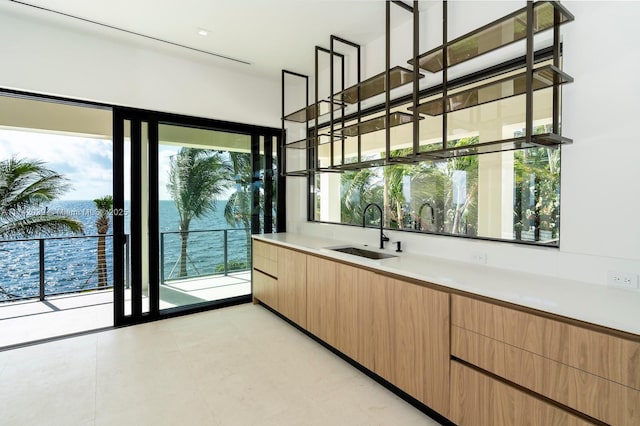 650 Lugo Ave, Coral Gables, FL 33156 - bar with a wealth of natural light and a sink