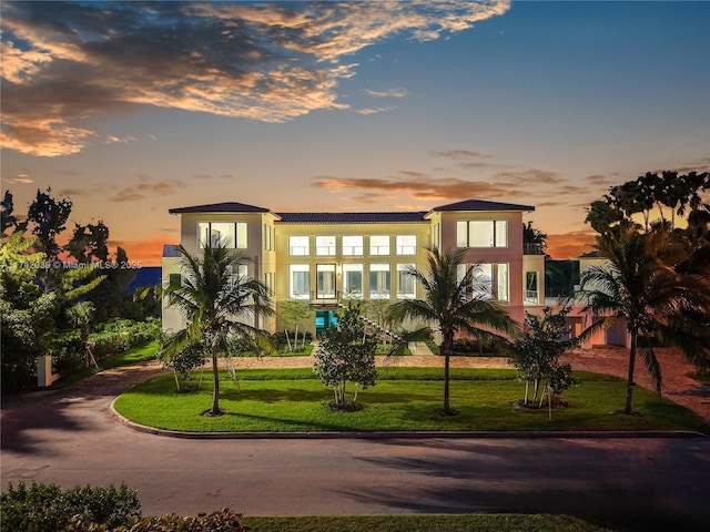 650 Lugo Ave, Coral Gables, FL 33156 - view of front of property with a yard and stucco siding