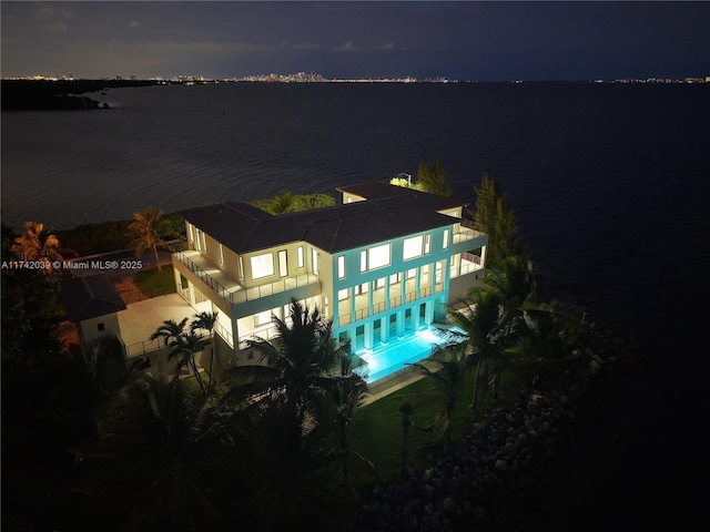 view of pool featuring a water view