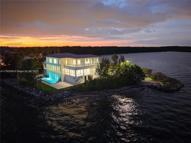 view of dock featuring a water view and a balcony