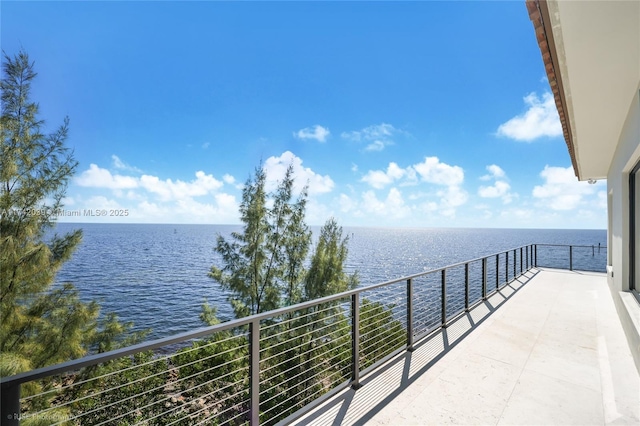 balcony featuring a water view