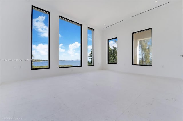 650 Lugo Ave, Coral Gables, FL 33156 - spare room featuring a wealth of natural light and a water view