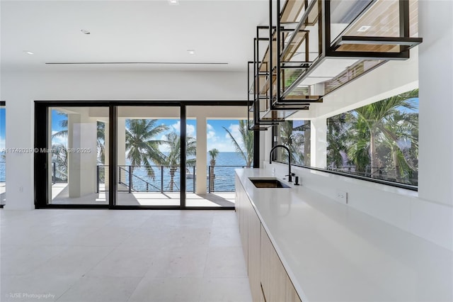 650 Lugo Ave, Coral Gables, FL 33156 - interior space with a sink, a water view, and light tile patterned flooring