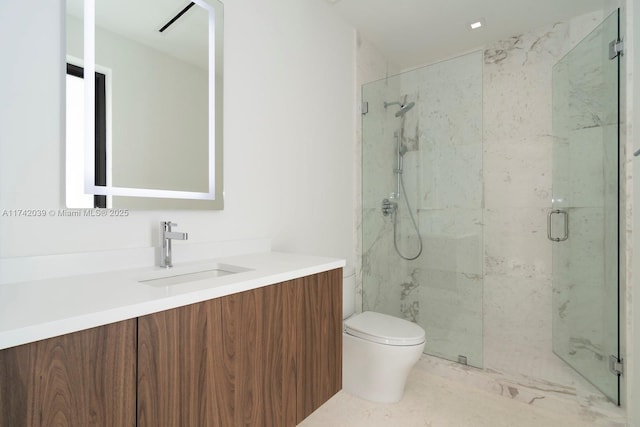 bathroom featuring a marble finish shower, toilet, and vanity