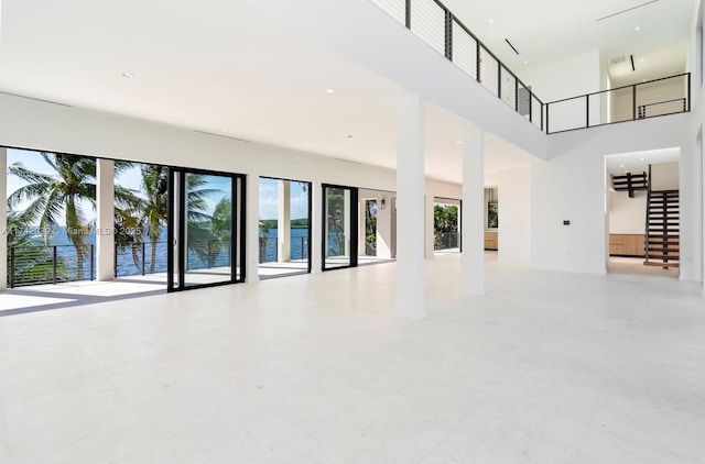 650 Lugo Ave, Coral Gables, FL 33156 - unfurnished living room featuring a towering ceiling