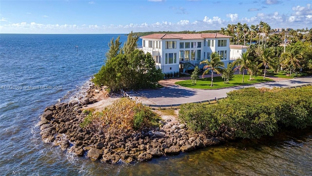 exterior space with a yard and a water view