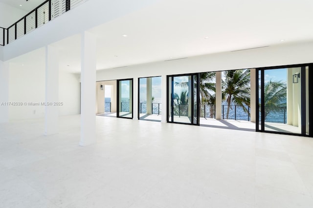 unfurnished room featuring recessed lighting and a healthy amount of sunlight