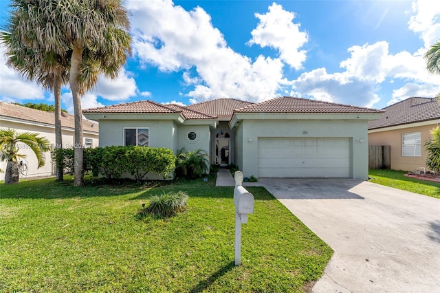 mediterranean / spanish-style home with a garage and a front lawn