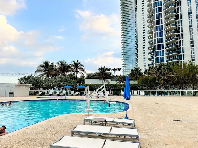 view of swimming pool featuring a patio area