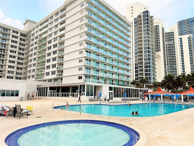 view of pool featuring a gazebo and a patio area