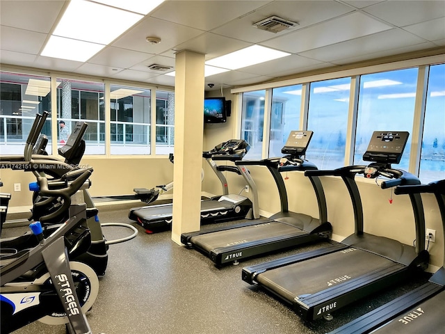 exercise room featuring a paneled ceiling