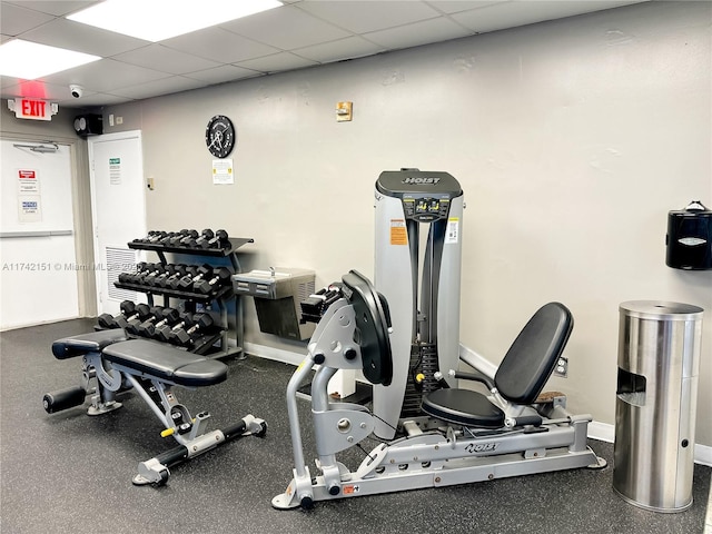 workout area featuring a paneled ceiling