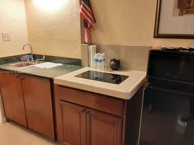 bathroom featuring tile patterned flooring and sink