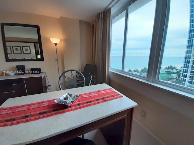 dining room featuring a water view