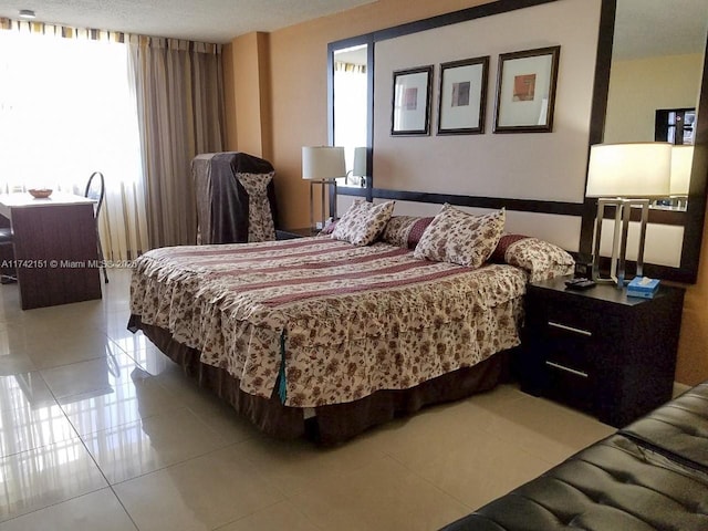 tiled bedroom featuring multiple windows