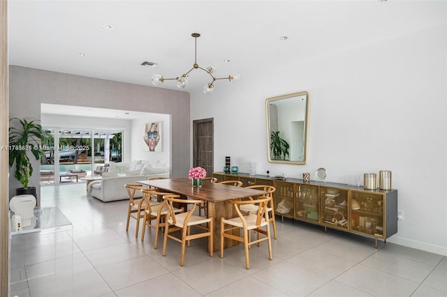 dining space with visible vents, light tile patterned floors, and a notable chandelier