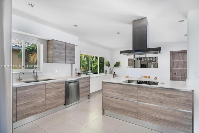 kitchen featuring exhaust hood, a sink, modern cabinets, black electric stovetop, and stainless steel dishwasher
