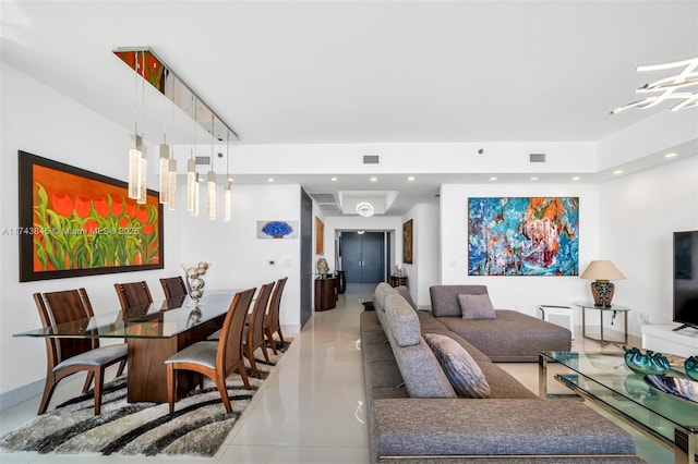 living area with visible vents and recessed lighting