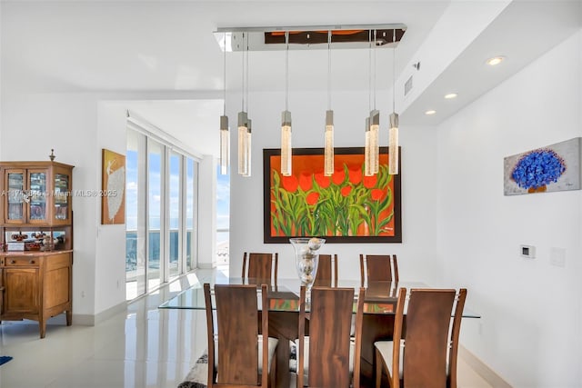 dining area with recessed lighting, visible vents, and baseboards