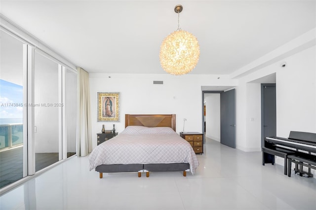 bedroom featuring a wall of windows, access to outside, visible vents, and an inviting chandelier