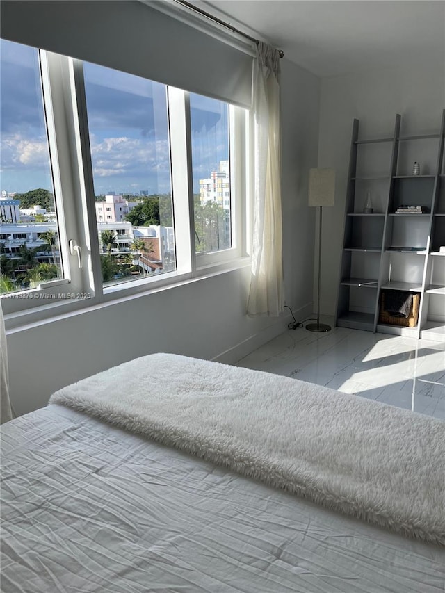 bedroom featuring multiple windows