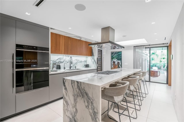 2415 San Domingo St, Coral Gables, FL 33134 - kitchen with island range hood, modern cabinets, a kitchen island, brown cabinets, and a sink