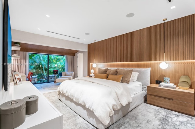 2415 San Domingo St, Coral Gables, FL 33134 - bedroom featuring access to exterior, vaulted ceiling, and wood walls
