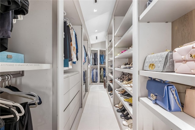 2415 San Domingo St, Coral Gables, FL 33134 - spacious closet featuring lofted ceiling and light tile patterned floors
